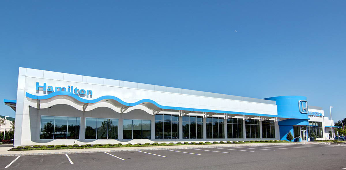Front of the Hamilton Honda building with signage in Hamilton, NJ